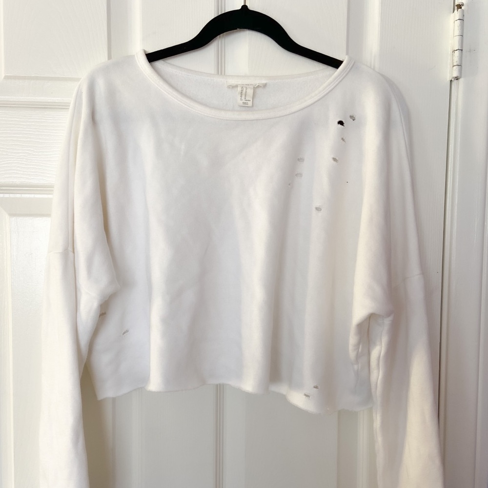 cropped and distressed white jumper